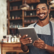 man holding tablet in restaurant