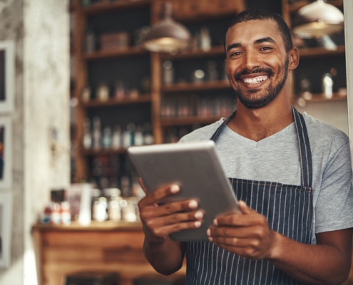 man holding tablet in restaurant