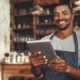 man holding tablet in restaurant